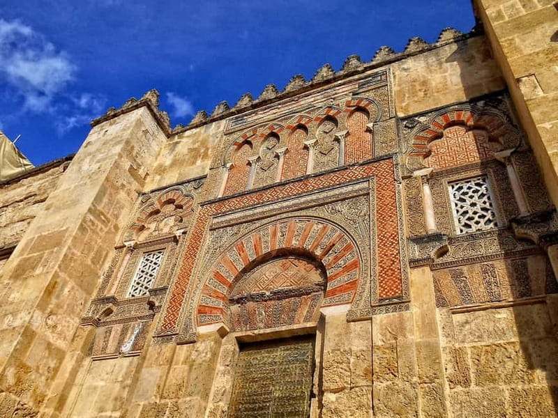From Seville: Cordoba Day Trip with Guided Tour - First views in Cordoba: Roman Bridge stop and river energy