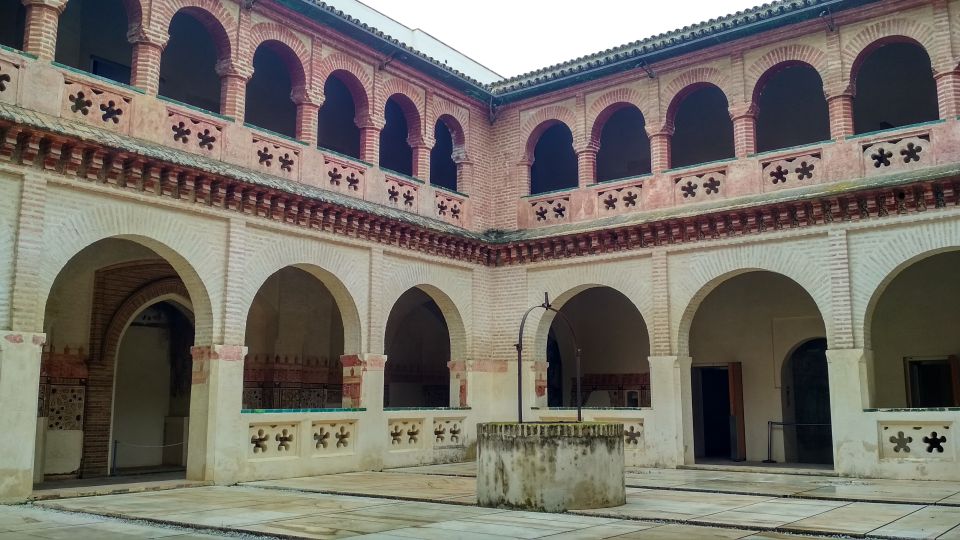 From Seville: Italica Roman City & Medieval Monastery Tour - Entering Roman Italica: The Emperors, the Amphitheater, and the Hidden World