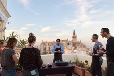 Sevilla: Rooftop Paella Cooking Class & 30-minute expert Q&A - Welcome drink, appetizers, and easy group bonding