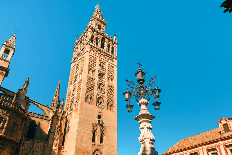 Seville: Alcázar, Cathedral & Giralda Fast Track Guided Tour - The Royal Alcázar: Mudejar, Gothic, and Stucco Courtyard Magic