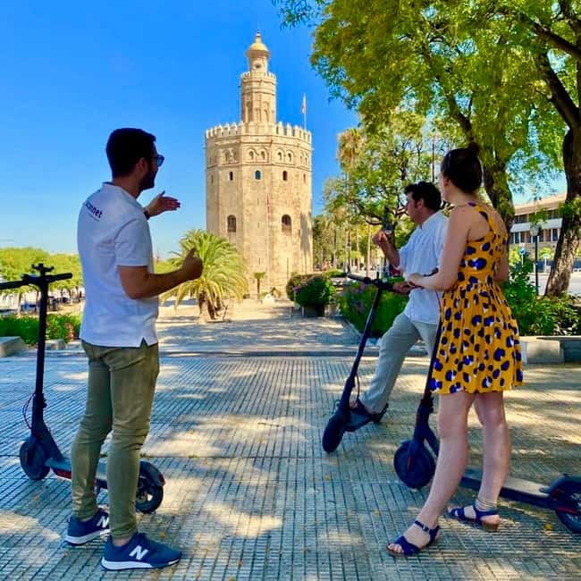 Seville: Electric Bike City Tour - Starting at SCOONET: riding help first, sights second