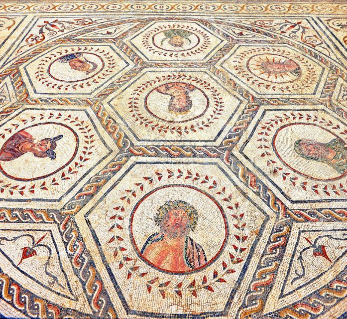 Seville: Italica Roman Ruins City Tour - Walking the Italica ruins: homes, floors, and mosaic magic