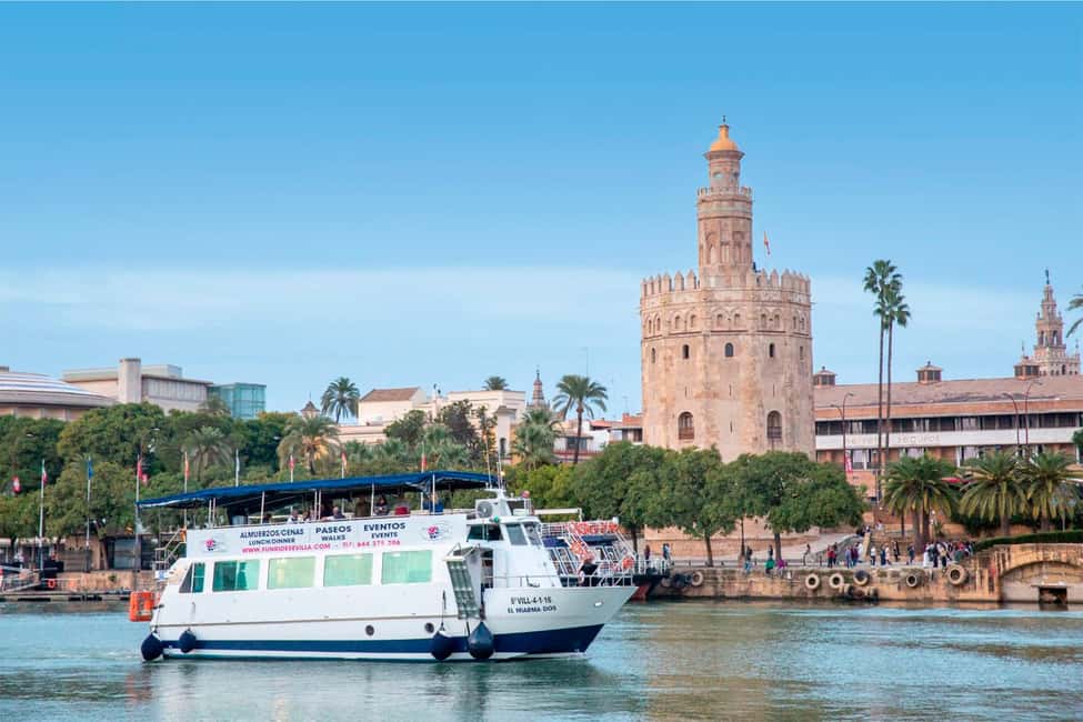 Seville: Restaurant boat ride on the Guadalquivir River with lunch/dinner - The view route on the Guadalquivir: Triana, the Maestranza, Torre del Oro