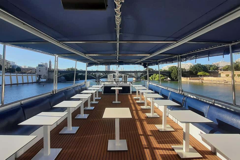 Seville: Restaurant boat ride on the Guadalquivir River with lunch/dinner - The boat experience: El Miarma Dos comfort and real conveniences