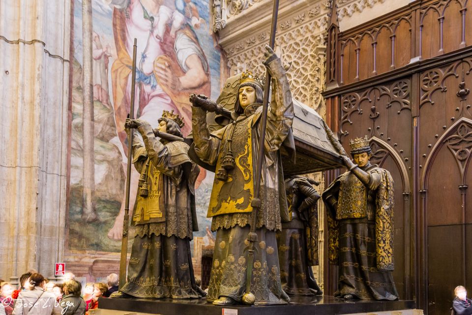 Seville: Small-Group Cathedral and Giralda Tour with Tickets - Seville Cathedral’s must-see interiors: altar, choir, baptistry, and Columbus