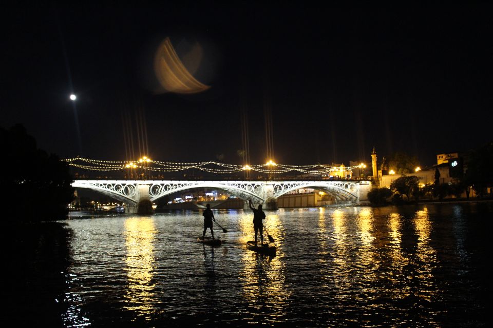 Seville: Sunset and Evening Paddle Boarding Tour - Triana Bridge Lights and Torre del Oro Photo Time