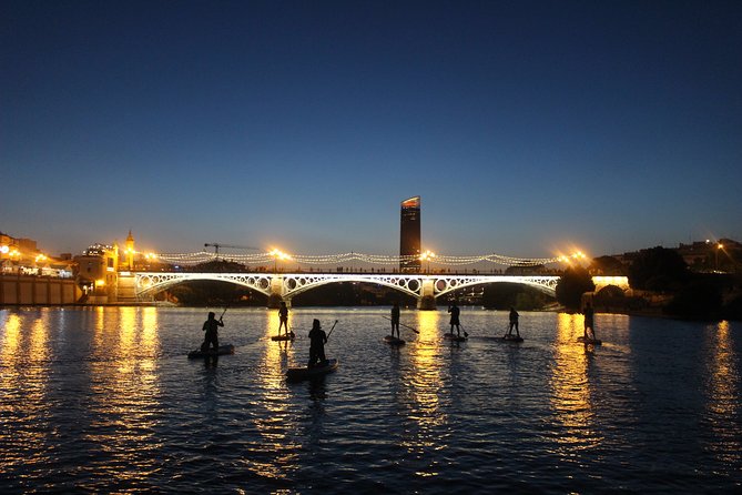 Seville: Sunset in Paddle Surf - Torre del Oro and the early-arrival view