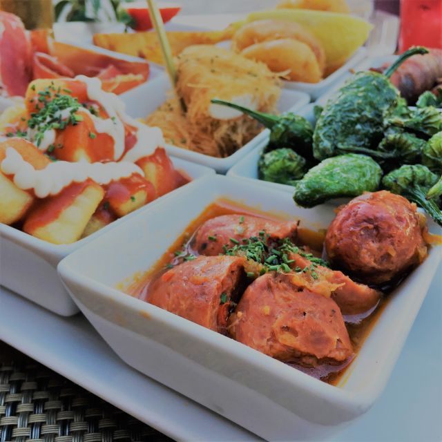 Seville: Tapas and Flamenco Experience - Tapas tour in Triana: what you’ll taste and how it’s served