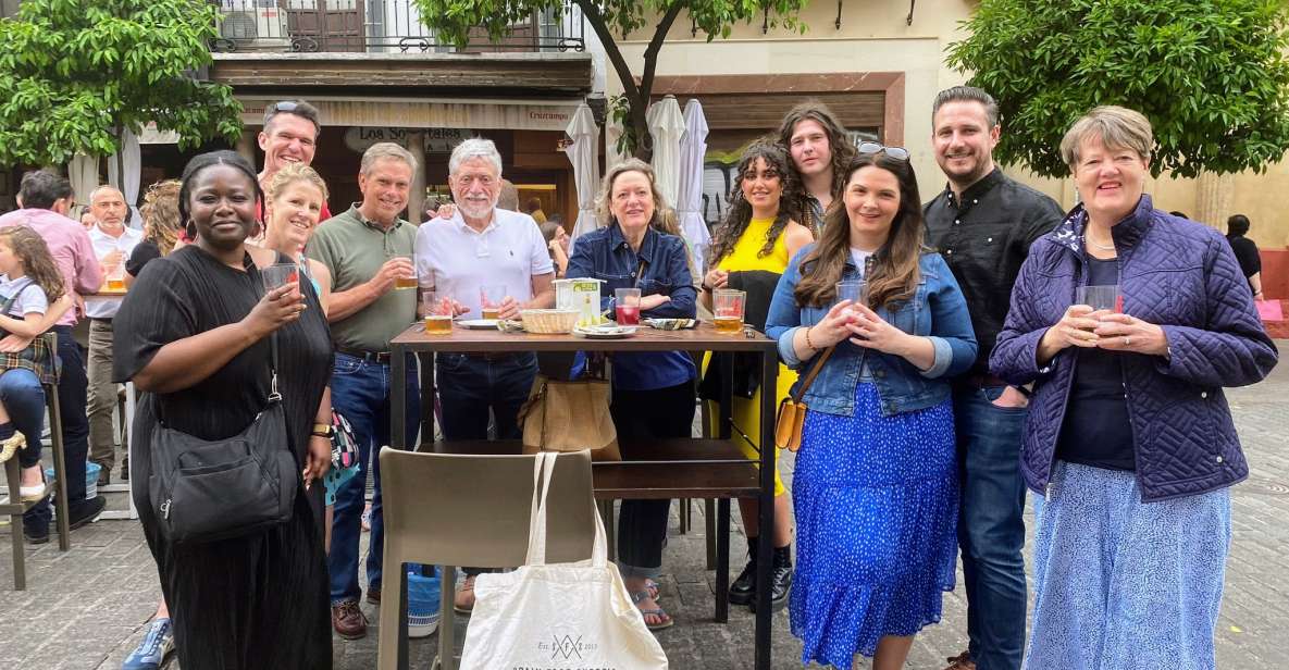 Seville: Tapas, Taverns, and History Walking Tour - Entering Seville Through Tapas Culture