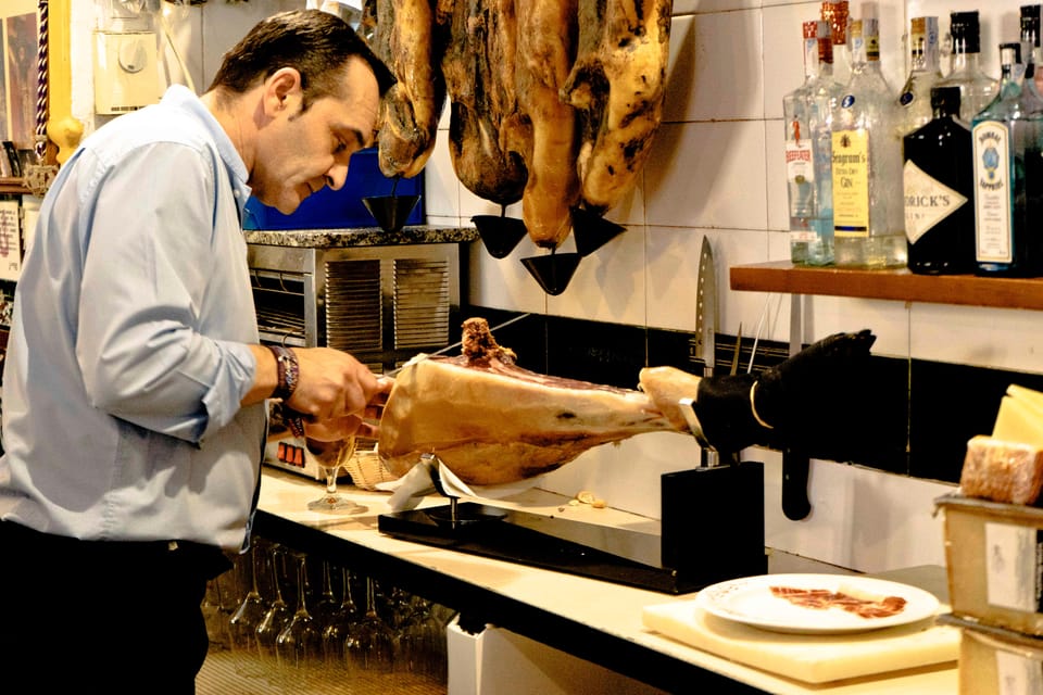 Seville: Wine and Gourmet Tapas Tour - Final stop: an awarded Seville dinner with wine tasting and food tasting