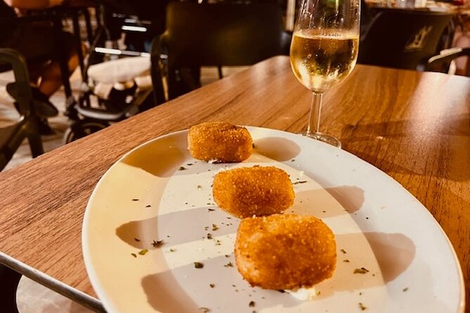 The Ultimate Seville Wine Tour with Food - Calle Mateos Gago: more wine, more food, and built-in variety (30 minutes)